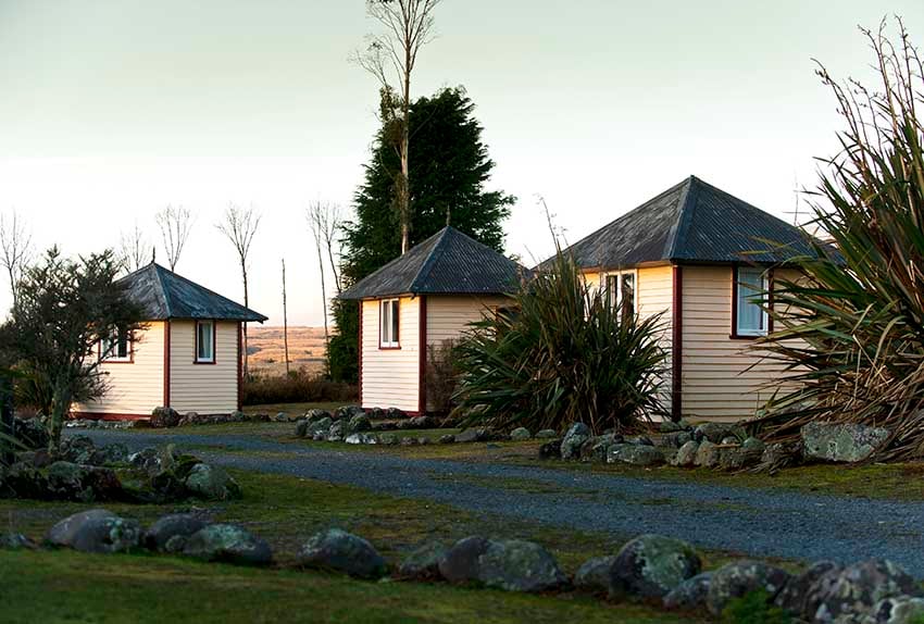 Discovery Lodge Tongariro rustic weatherboard camping huts
