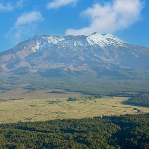 Mt Ruapehu with Discovery Lodge in the middle of the picture. Surrounded by nature.