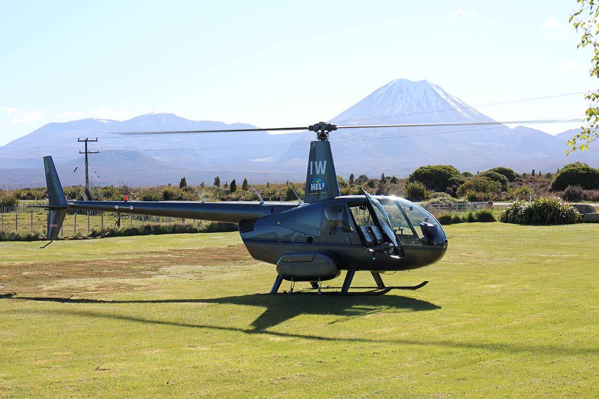 Helisika ZK-HIW at Discovery Helipad with Tongariro & Ngauruhoe in the background