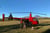 R22 parked at Discovery Lodge with Ngauruhoe in the background