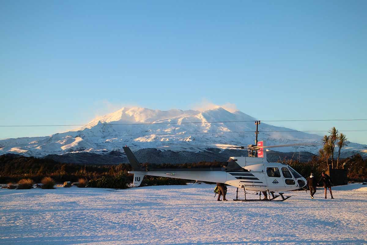 Helisika ZK-HIU on a snowy day at Discovery with Mt Ruapehu in the background