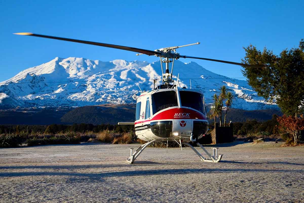 Beck Helicopters ZK-HHA at Discovery's helipad with Mt Ruapehu