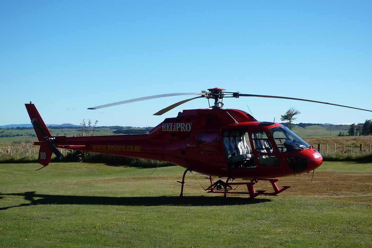 Helipro ZK-HXO fine blue sky day at Discovery helipad