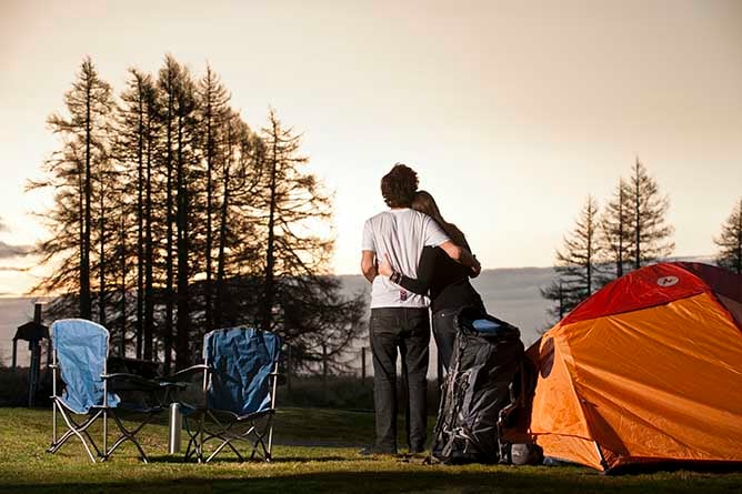 Two campers with a marmot tent at Discovery Lodge close to the Tongariro Alpine Crossing